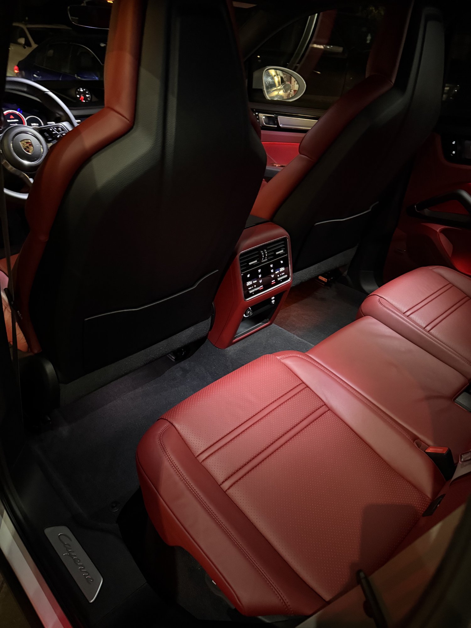 Porsche Cayenne rear seat interior detailing — red leather backseat deep clean
