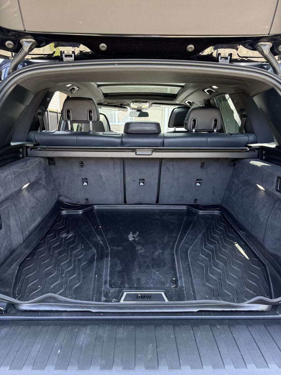 Before — BMW cargo area dirty